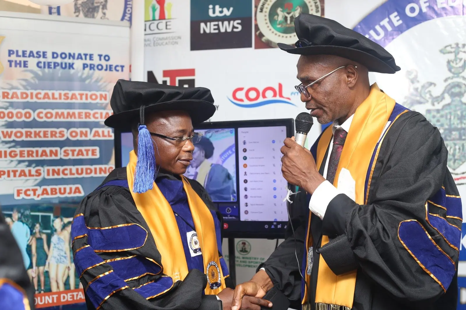 A fellow is presented with her certificate, October 2023